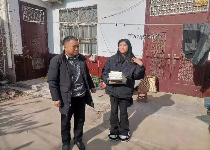 張建平：愛心助困，情滿寒冬